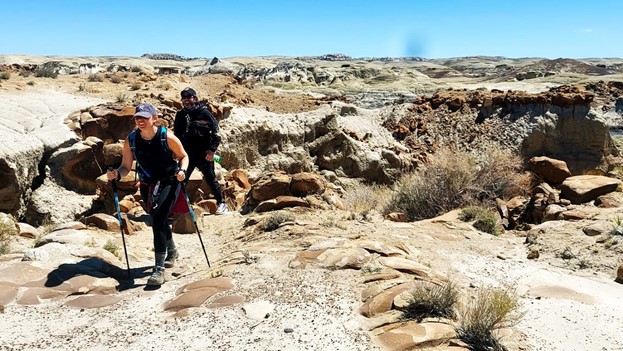 Couple hiking through Bisti Badlands